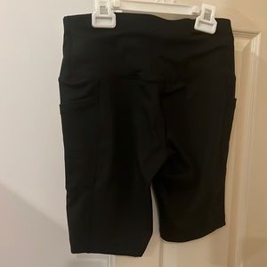 Black bike shorts with pockets on both sides